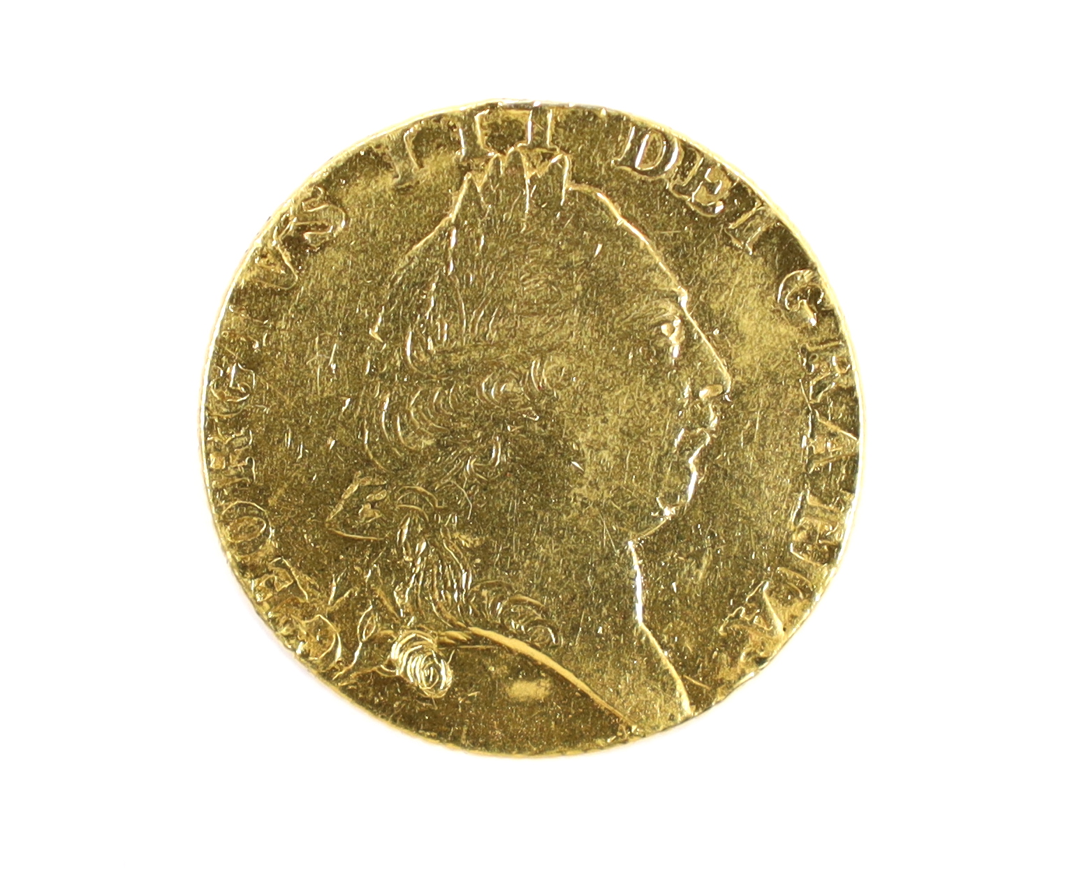 British gold coins, George III gold spade guinea 17?9, demounted and pitted otherwise near VF